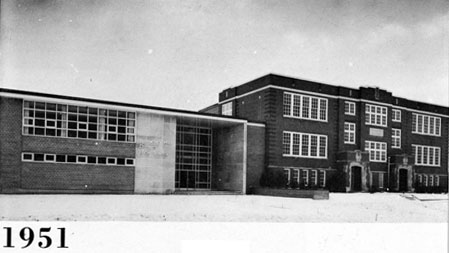 Image of larger schoolhouse with lots of windows. Text underneath reads 1951